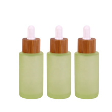 Frosted logo printing 30ml glass dropper bottle for cosmetic oil with bamboo lid
